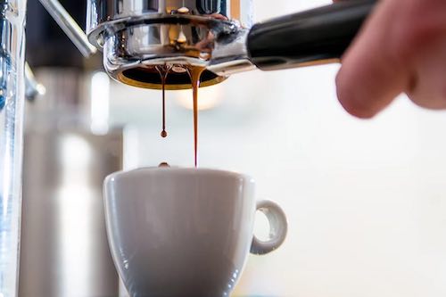 Making Espresso in white Cup.