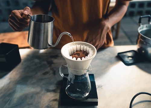 Making pour-over coffee at our shop.